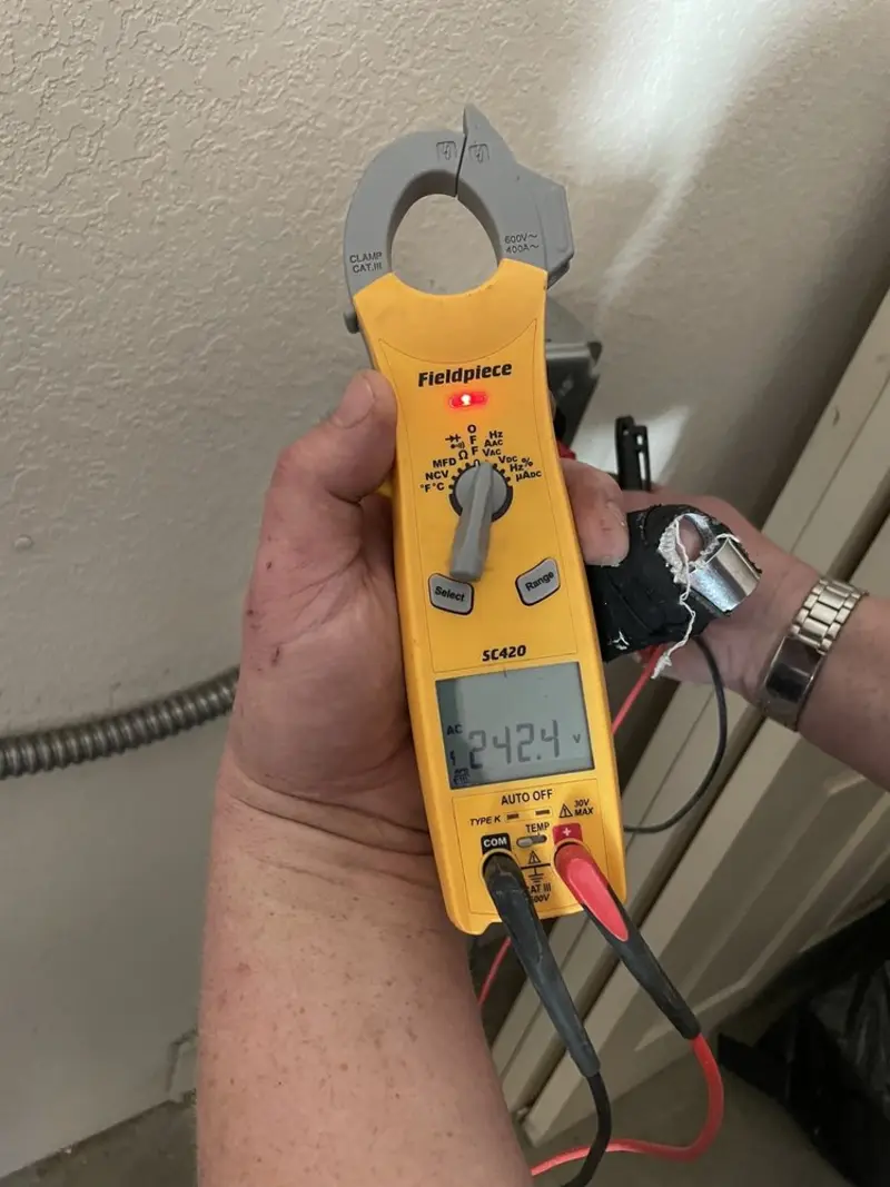 Voltage testing with clamp meter during Electrical Installation Services in Vernon